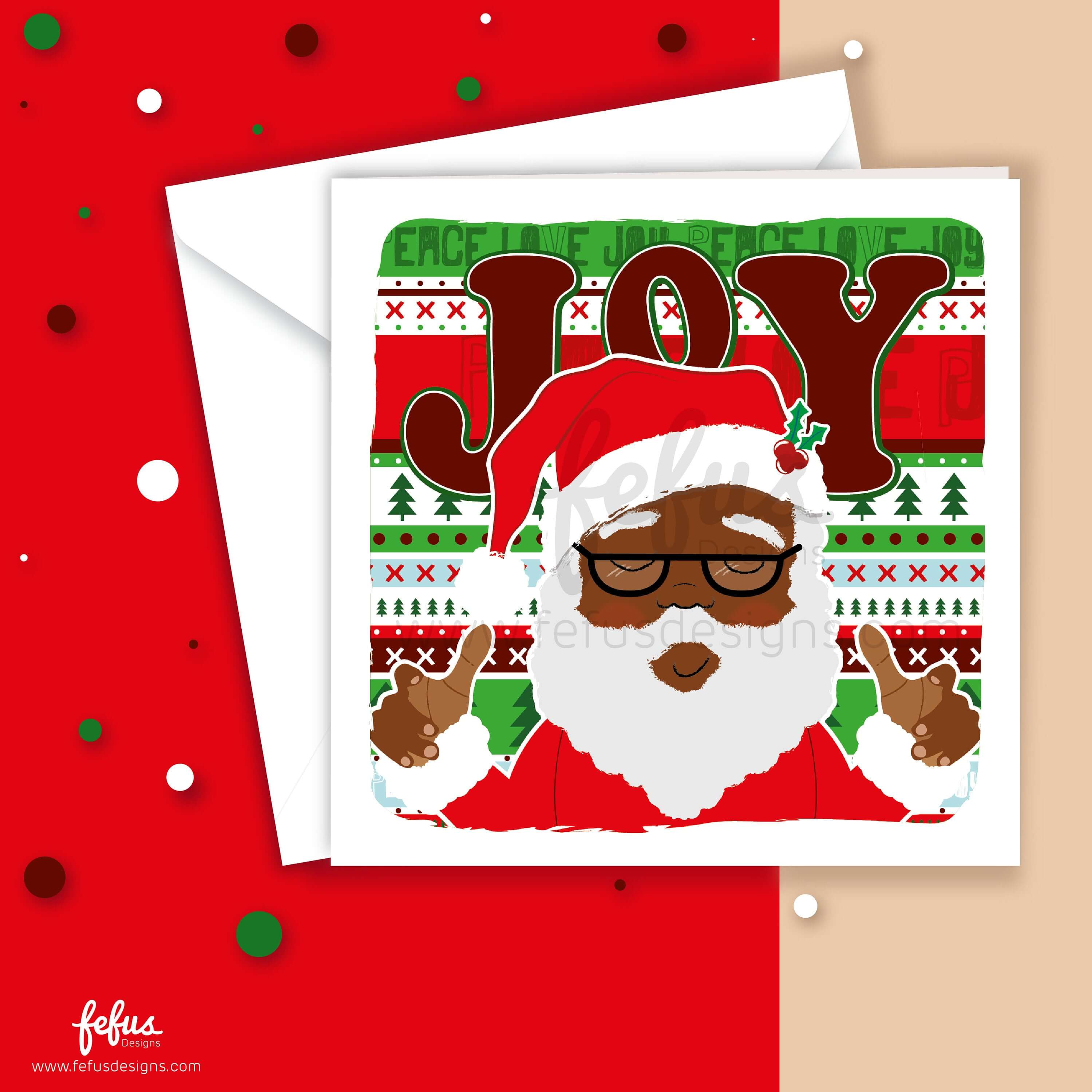 Close-up of a Black Santa Christmas card with Santa's cheerful face and holly-adorned hat. The background showcases the word "Joy" in festive colours, creating an artistic and heartfelt Christmas greeting. Printed on eco-friendly, FSC certified, recyclable card by Fefus Designs.