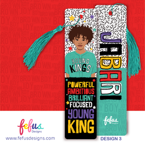 Two rectangular bookmarks with teal tassels. One features an illustration of a person with curly hair wearing a teal shirt with the text YOUNG KINGS, followed by the words POWERFUL AMBITIOUS BRILLIANT FOCUSED YOUNG KING. The other says JABARI.