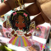 Ariyonna Rasta Fairy Magic keyring featuring a character with long locs and iridescent wings by Fefus Designs.  Empowering Kids with Joyful Diversity! Perfect Bag Charm Gift | Fefus Designs
