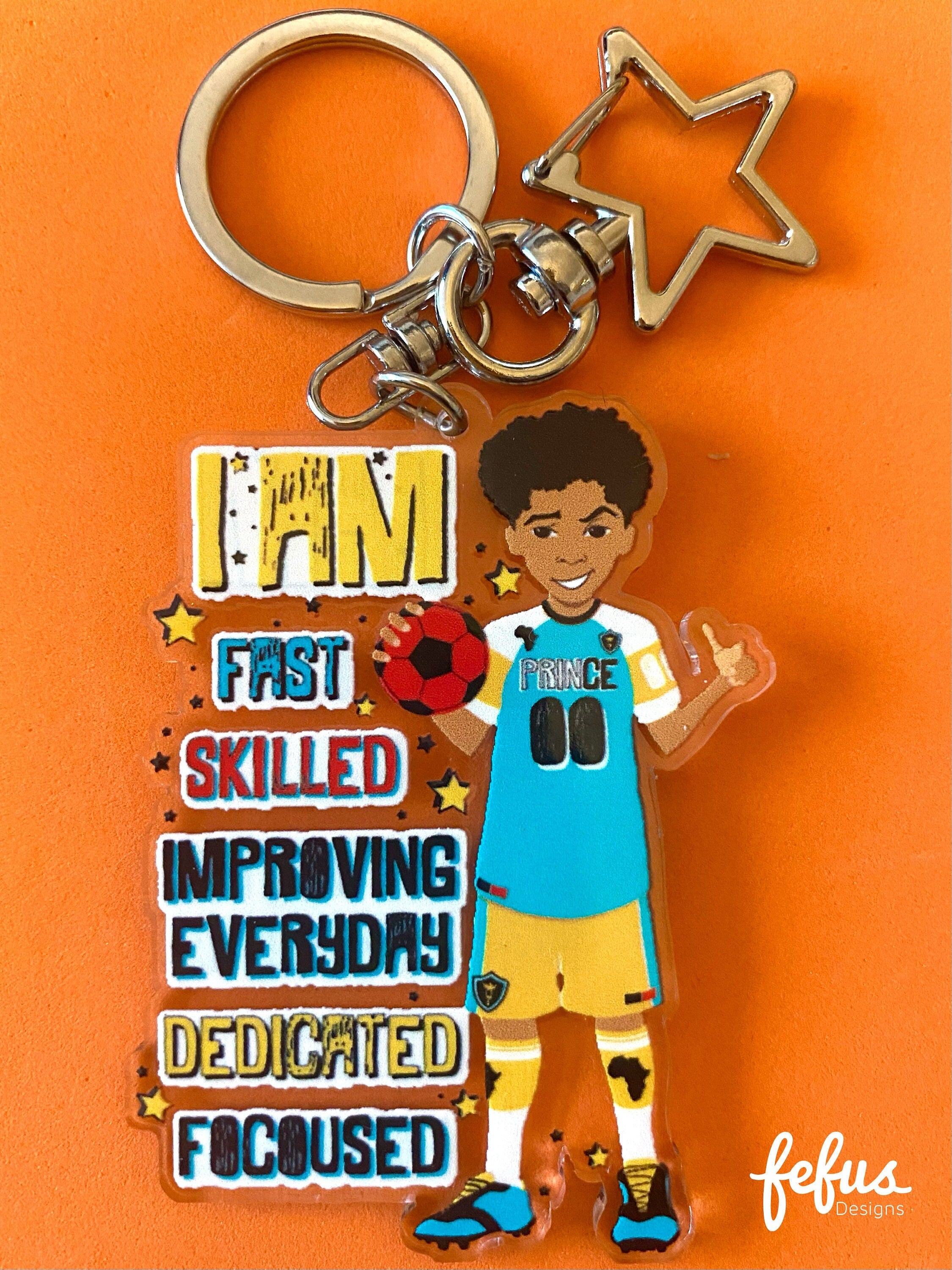 Double-sided Biracial Boy Footballer keychain made from clear acrylic. Perfect for young athletes to show their love for football and celebrate diversity. (63.5mm diameter)